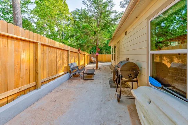a backyard of a house with outdoor seating
