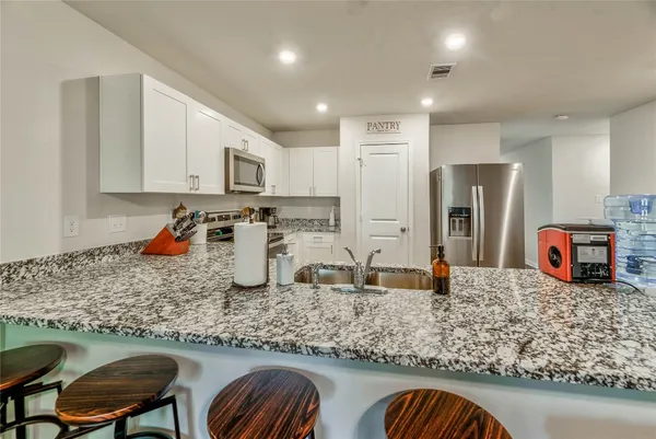 a view of a garage with a bike and storage
