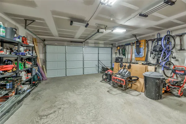 a view of a garage with a bike and storage