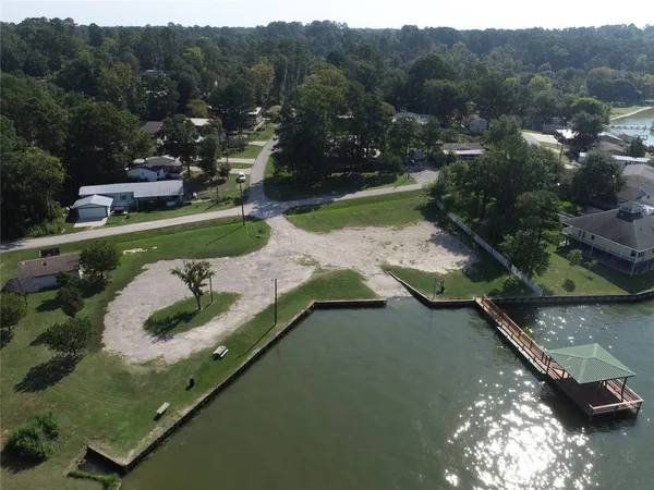 an aerial view of a house with a lake view