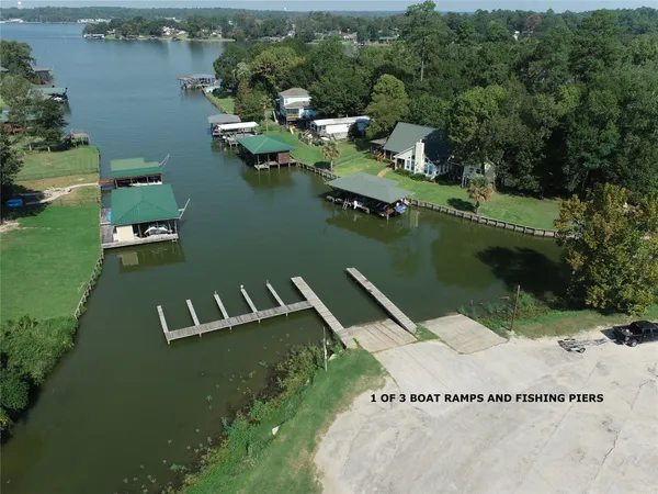 an aerial view of a house with a lake view