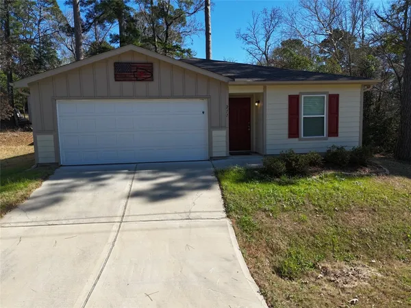 a view of a yard in front view of a house