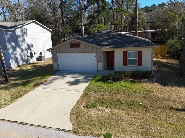 a view of a yard in front view of a house