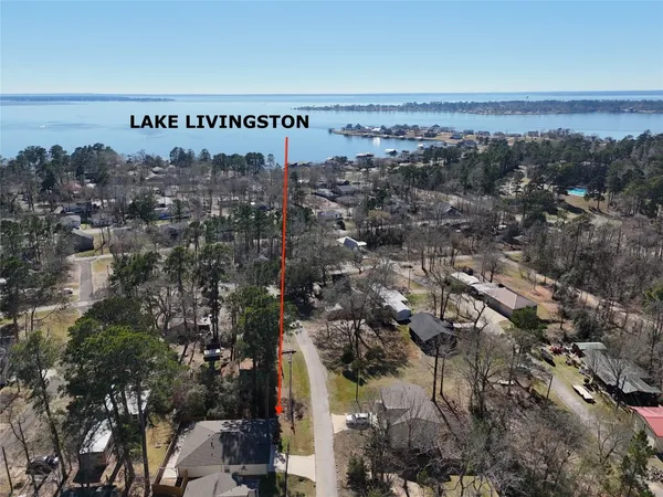 a view of a house with yard and a garden