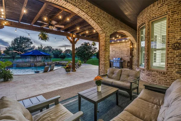 a outdoor living space with patio furniture and a potted plant
