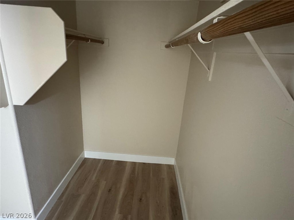 3962 Coyote Ridge Court Las Vegas, NV 89129 - Photo 24 of 35 Organized closet space with hanging rods for seamless storage solutions.