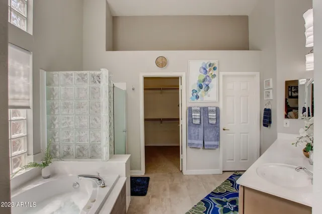 a bed room with a bed mirror and a window