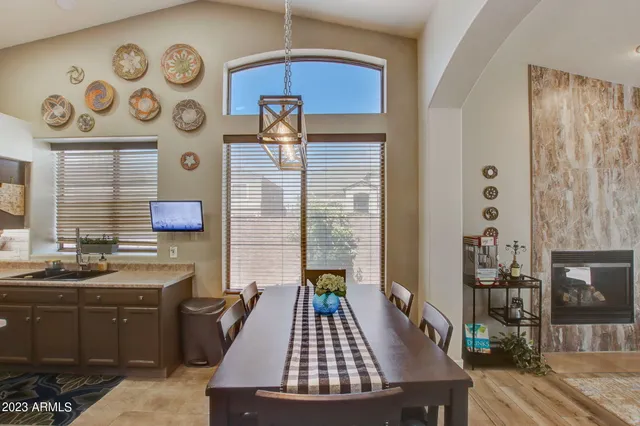 a kitchen with a sink a stove and cabinets