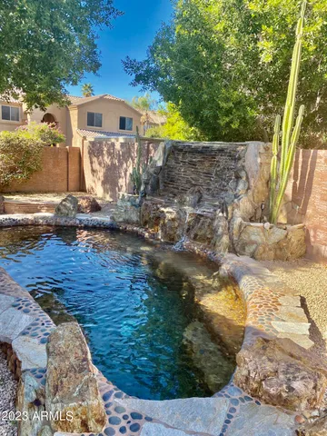 a view of a backyard with sitting area