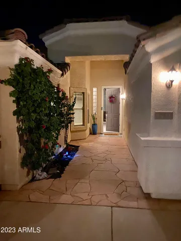 a view of a backyard with wooden fence