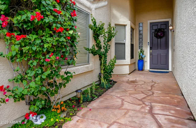 a front view of a house with garden