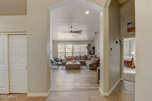 a living room with furniture and a large window