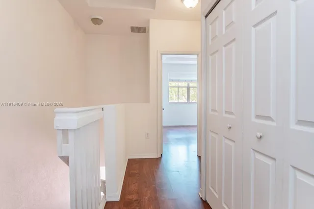 a view of a bathroom with wooden floor