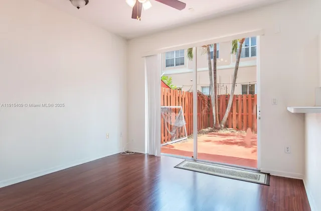 a view of front door with wooden floor