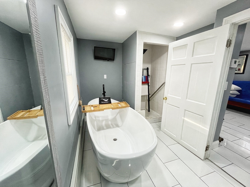 27 Overlook Road Holbrook, MA 02343 - Photo 11 of 25 a bathroom with a sink and a mirror
