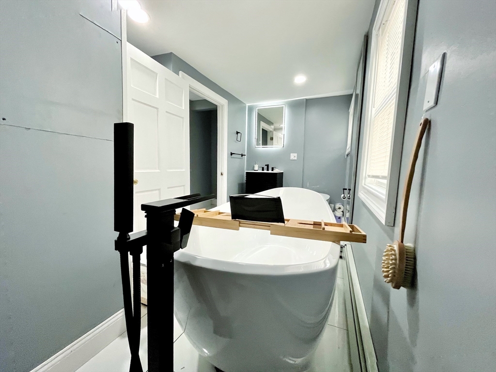 27 Overlook Road Holbrook, MA 02343 - Photo 12 of 25 a bathroom with a sink a toilet and mirror
