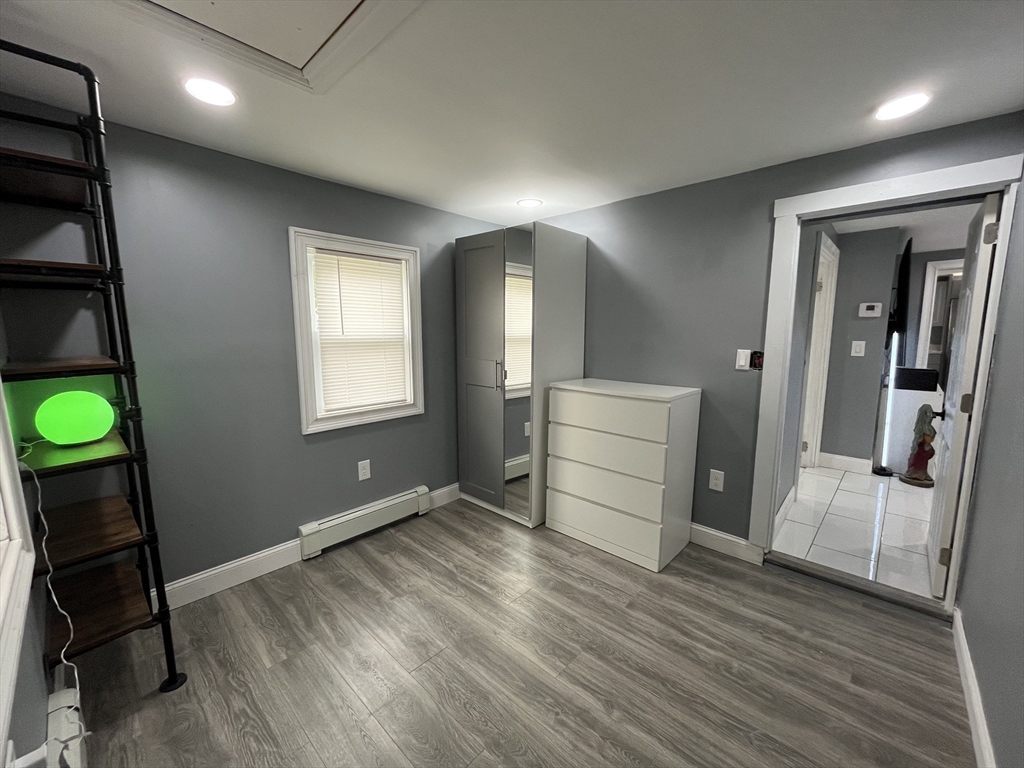 27 Overlook Road Holbrook, MA 02343 - Photo 13 of 25 a room with wooden floor and furniture