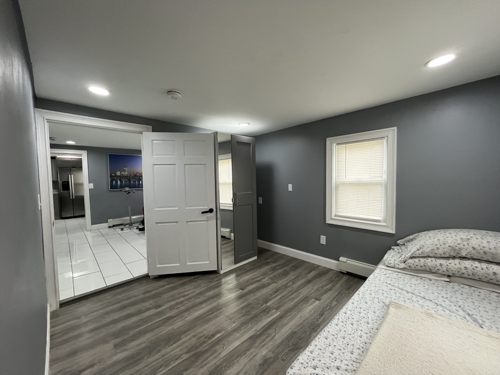 27 Overlook Road Holbrook, MA 02343 - Photo 15 of 25 a bedroom with a bed and bathroom