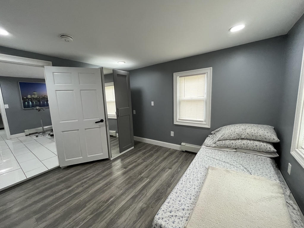 27 Overlook Road Holbrook, MA 02343 - Photo 16 of 25 a spacious bedroom with a bed and a refrigerator