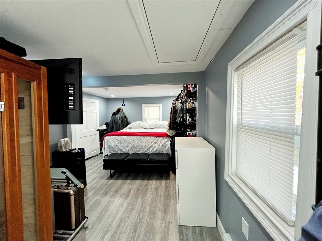 27 Overlook Road Holbrook, MA 02343 - Photo 17 of 25 a bedroom with a bed and wooden floor