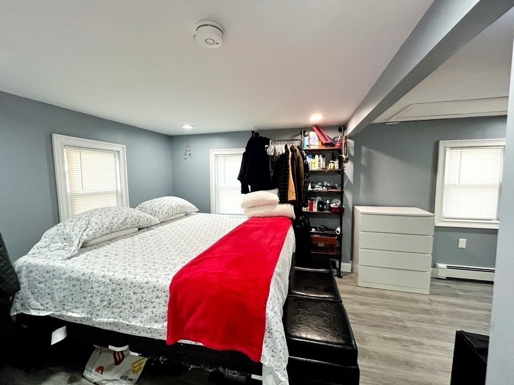 27 Overlook Road Holbrook, MA 02343 - Photo 18 of 25 a bed room with a bed and a walk in closet