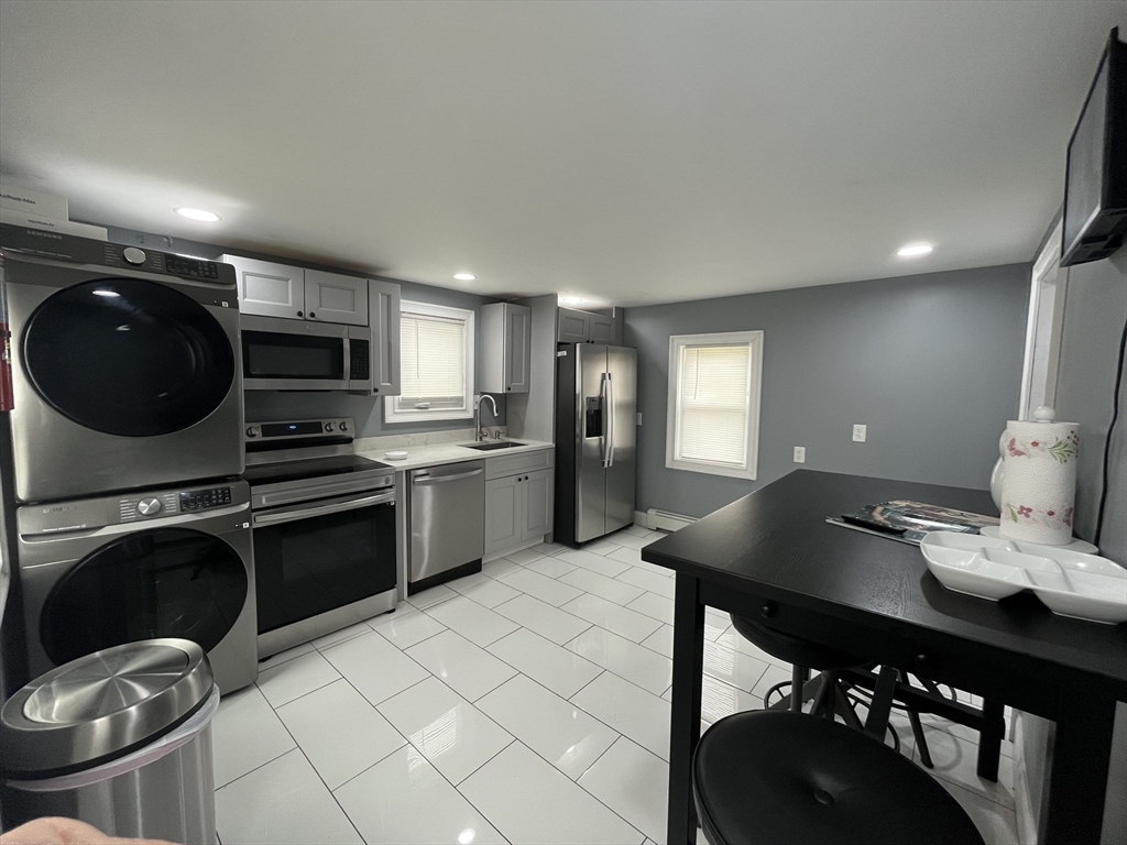 27 Overlook Road Holbrook, MA 02343 - Photo 25 of 25 a kitchen with a sink a stove and chairs