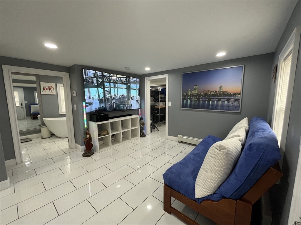 27 Overlook Road Holbrook, MA 02343 - Photo 6 of 25 a view of a livingroom with furniture and window