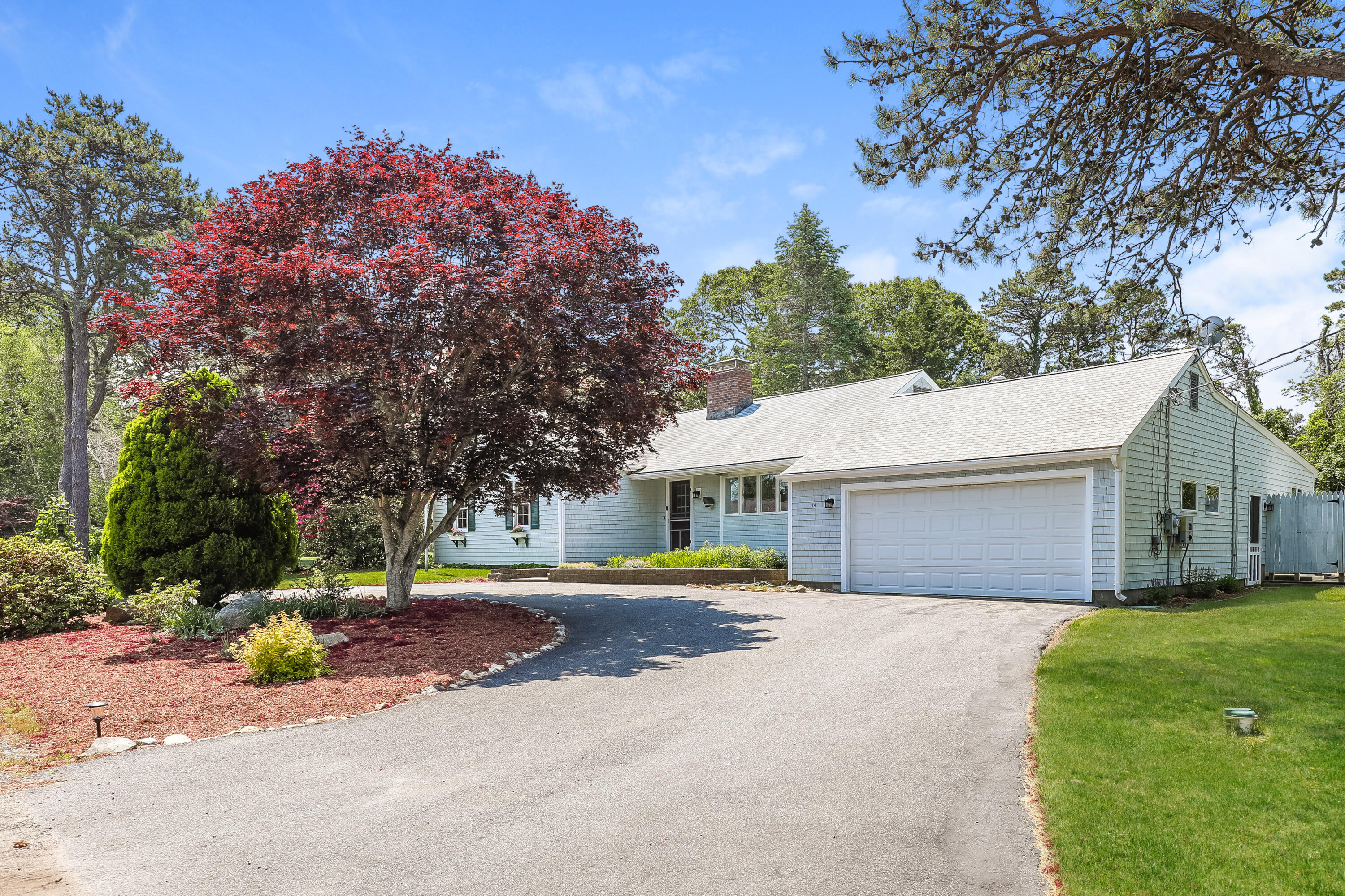 a house view with a backyard space