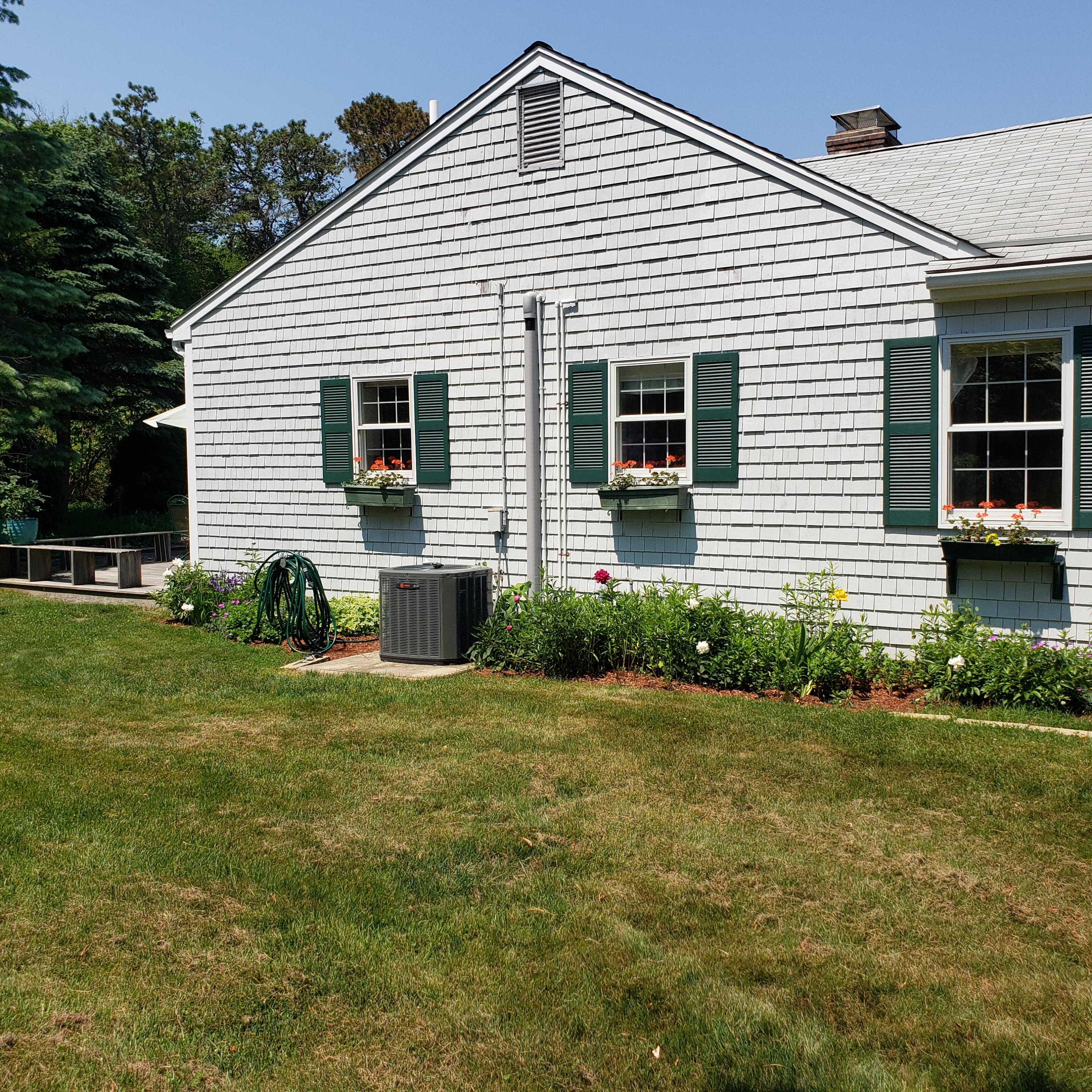 14 Captain Kidd Road East Sandwich, MA 02537 - Photo 22 of 29 a front view of a house with a yard