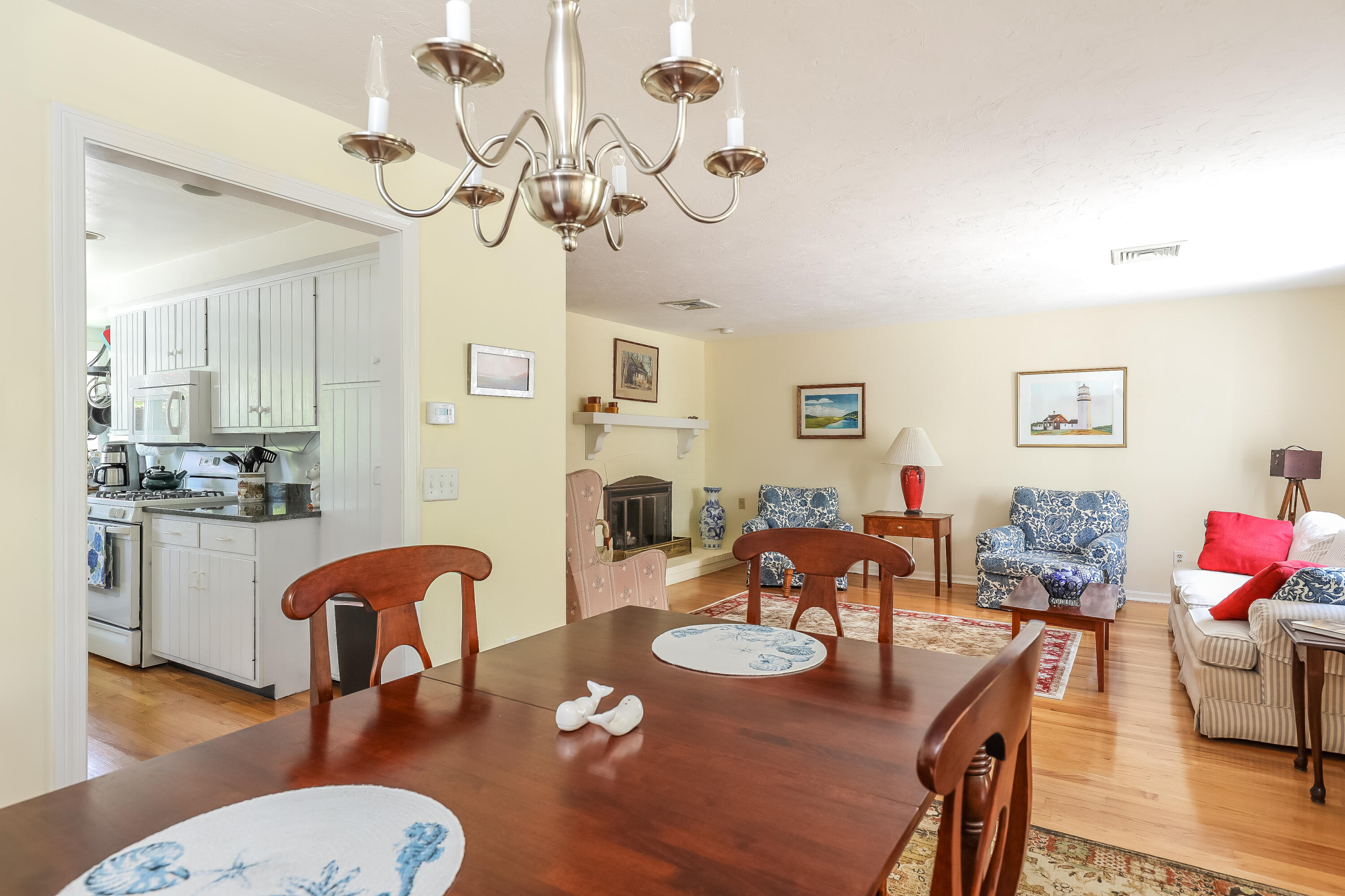 14 Captain Kidd Road East Sandwich, MA 02537 - Photo 5 of 29 a view of a dining room with furniture a chandelier and wooden floor
