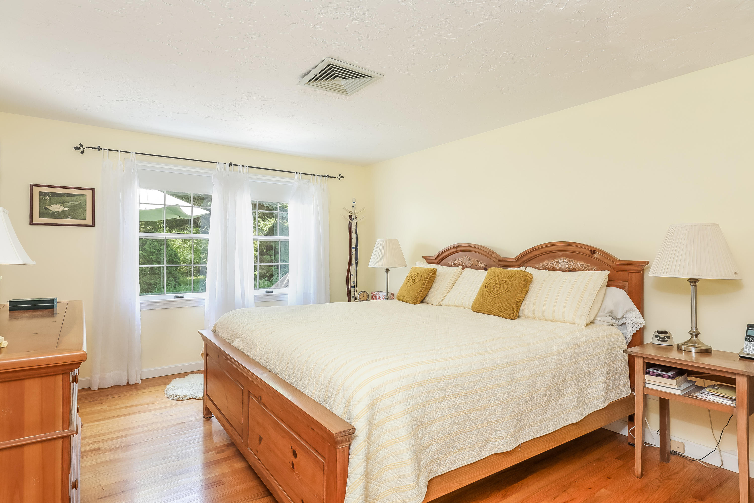 14 Captain Kidd Road East Sandwich, MA 02537 - Photo 10 of 29 a spacious bedroom with a bed and wooden floor