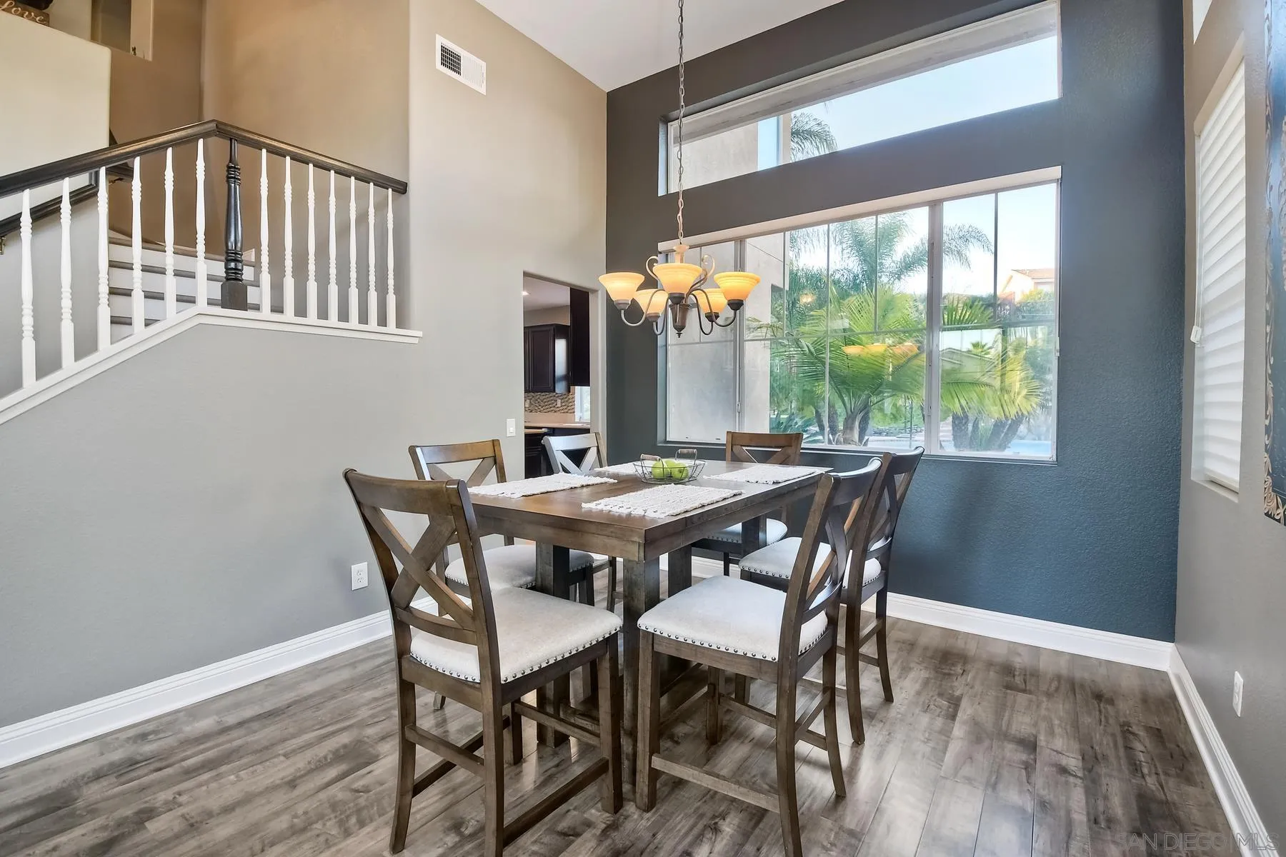 10340 Hitching Post Way Santee, CA 92071 - Photo 12 of 50 a dining room with furniture a rug and wooden floor
