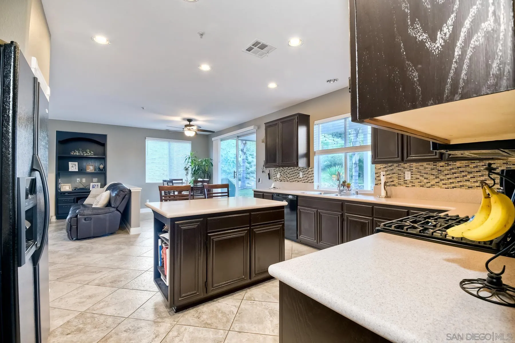 10340 Hitching Post Way Santee, CA 92071 - Photo 13 of 50 a kitchen with a sink a stove and chairs