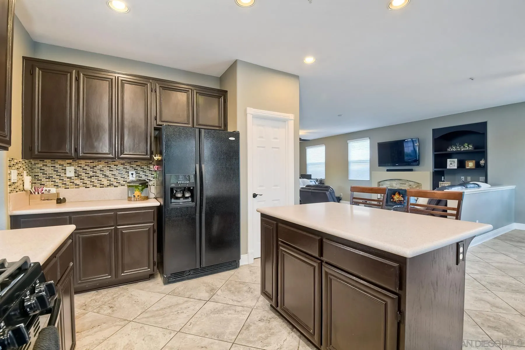 10340 Hitching Post Way Santee, CA 92071 - Photo 16 of 50 a kitchen with a sink refrigerator and microwave