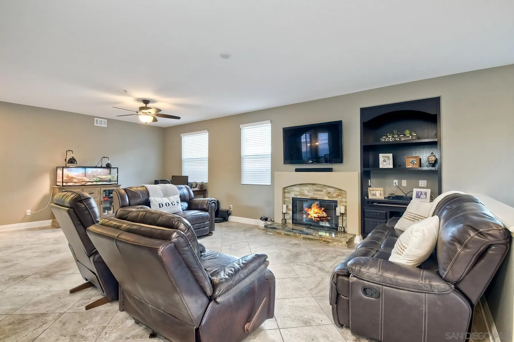 10340 Hitching Post Way Santee, CA 92071 - Photo 19 of 50 a living room with furniture fireplace and a flat screen tv