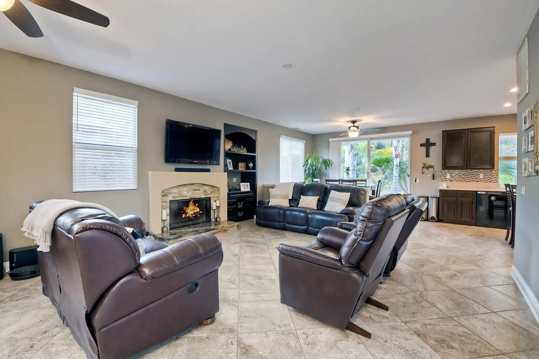 10340 Hitching Post Way Santee, CA 92071 - Photo 20 of 50 a living room with furniture a fireplace and a flat screen tv
