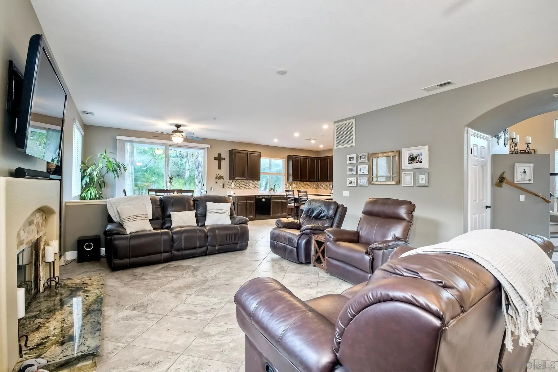 10340 Hitching Post Way Santee, CA 92071 - Photo 21 of 50 a living room with furniture a large window and a fireplace