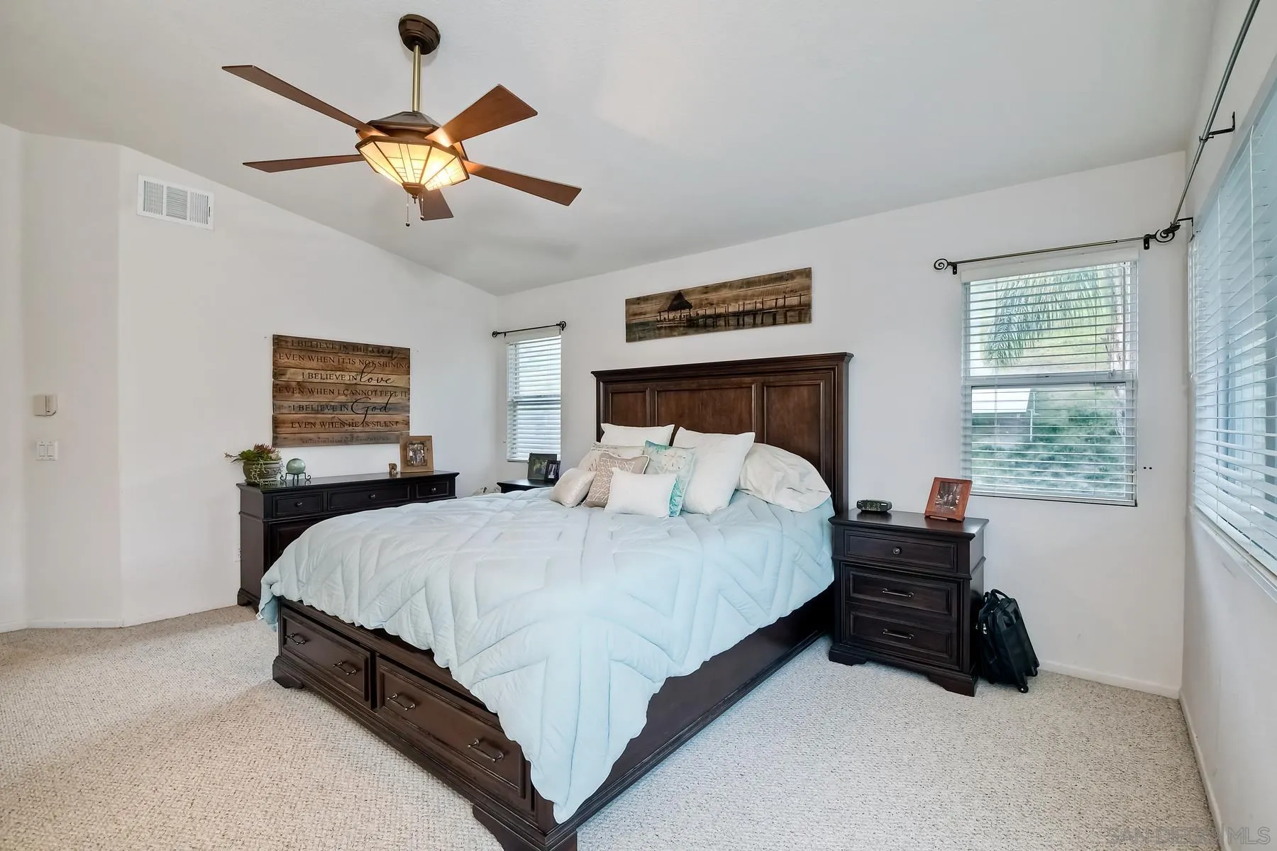 10340 Hitching Post Way Santee, CA 92071 - Photo 26 of 50 a bedroom with a bed and a chandelier