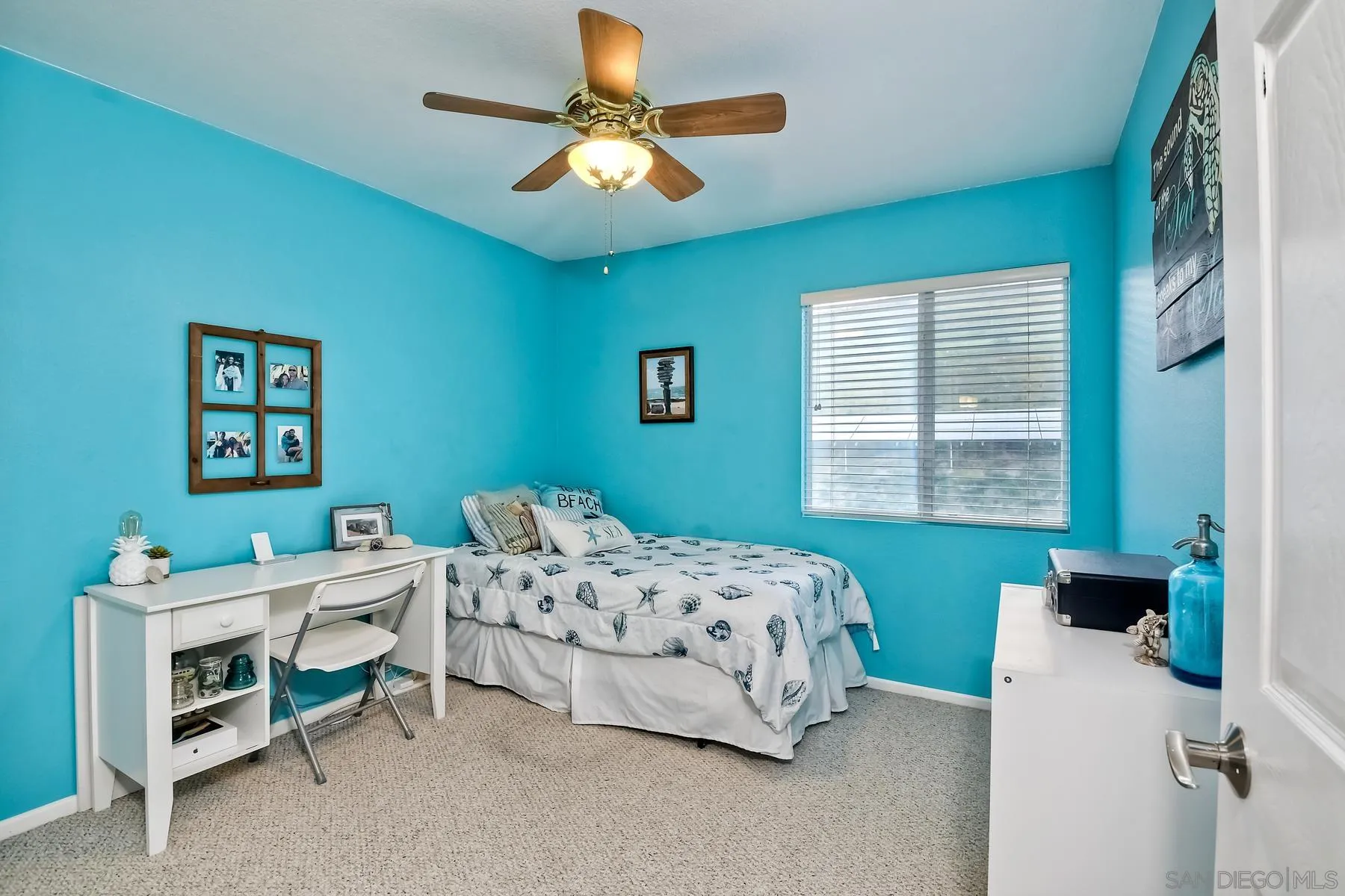 10340 Hitching Post Way Santee, CA 92071 - Photo 32 of 50 a bedroom with a bed and a chandelier