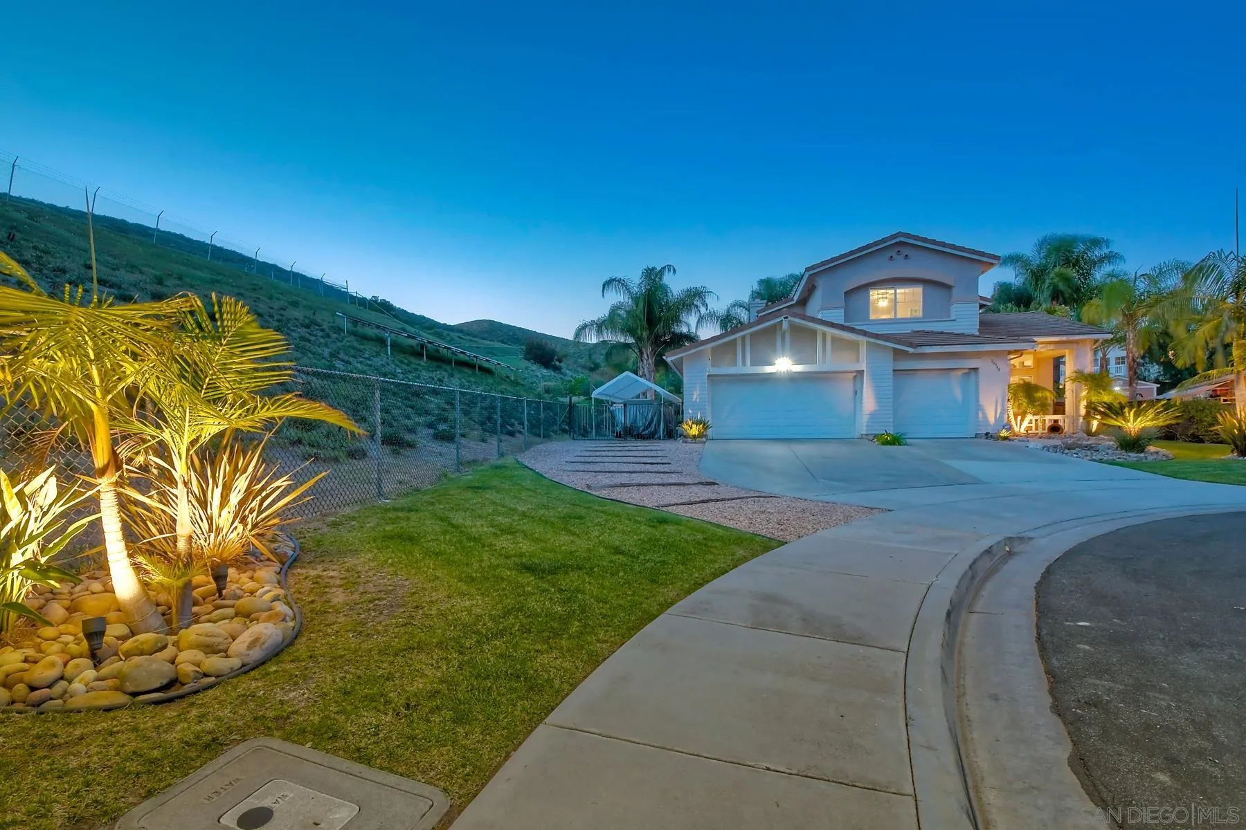 10340 Hitching Post Way Santee, CA 92071 - Photo 4 of 50 a front view of a house with garden