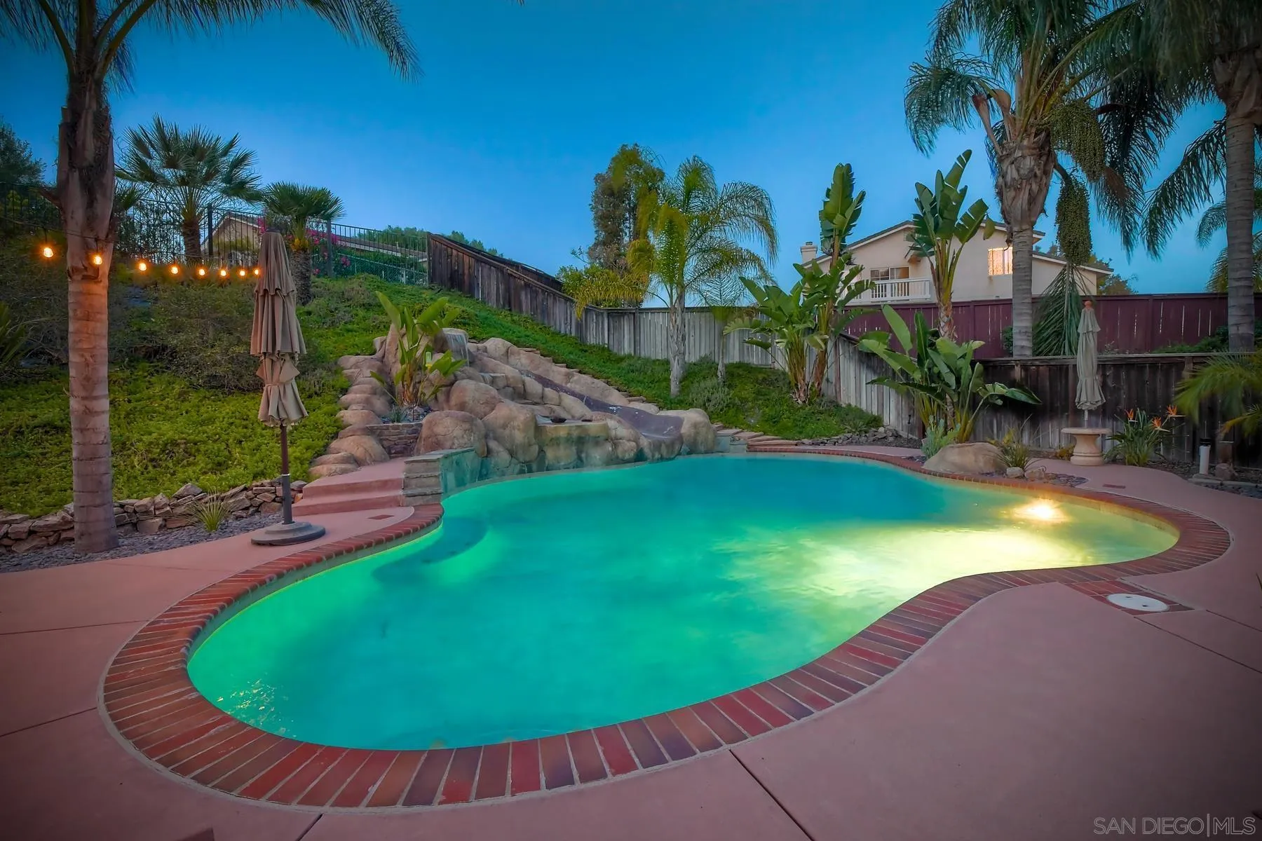 10340 Hitching Post Way Santee, CA 92071 - Photo 45 of 50 an aerial view of a swimming pool with a yard and palm trees