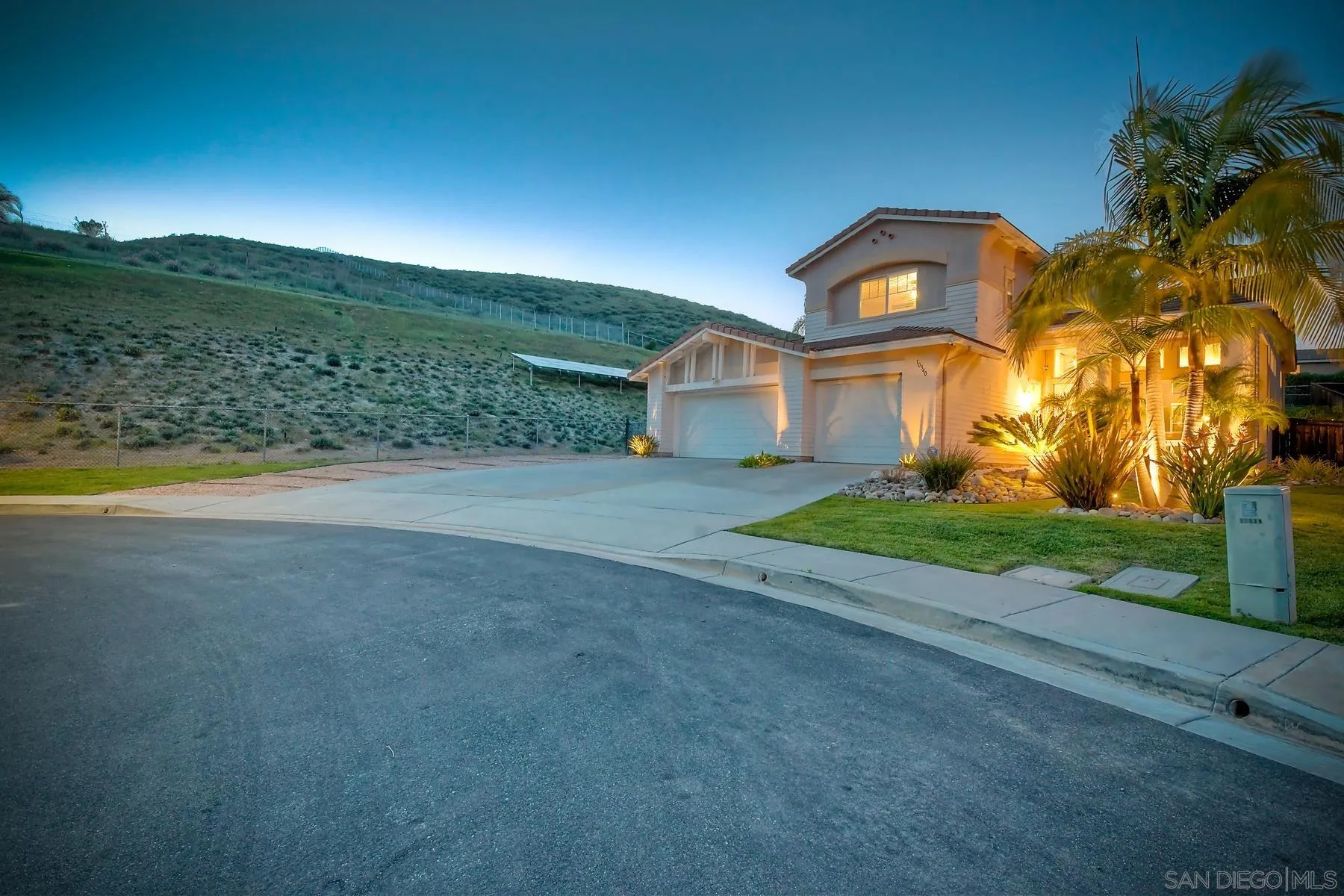 10340 Hitching Post Way Santee, CA 92071 - Photo 50 of 50 a view of a big house with a big yard and large trees