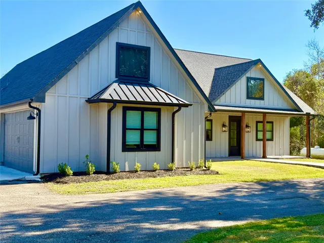 a view of a house with basketball court