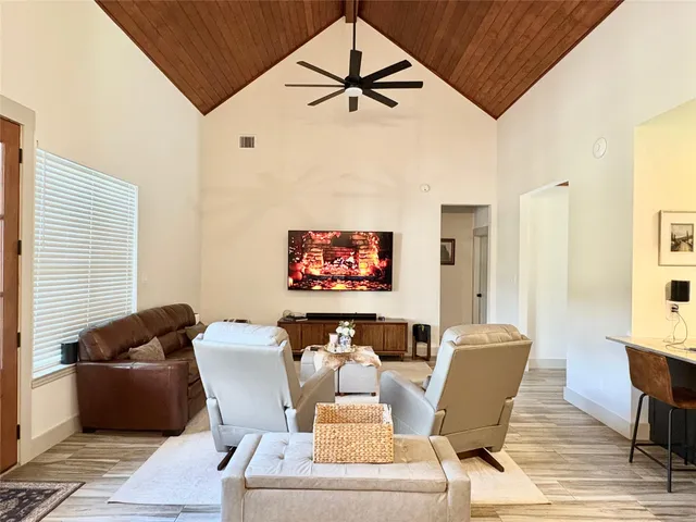 a view of a dining room with furniture and a window