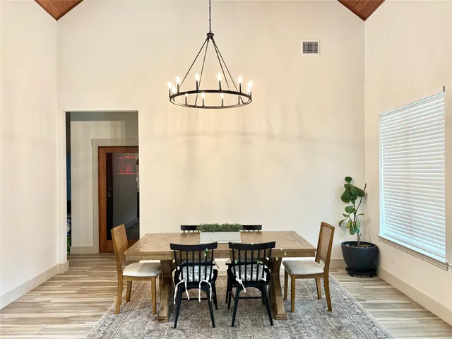 a view of a dining room with furniture and window