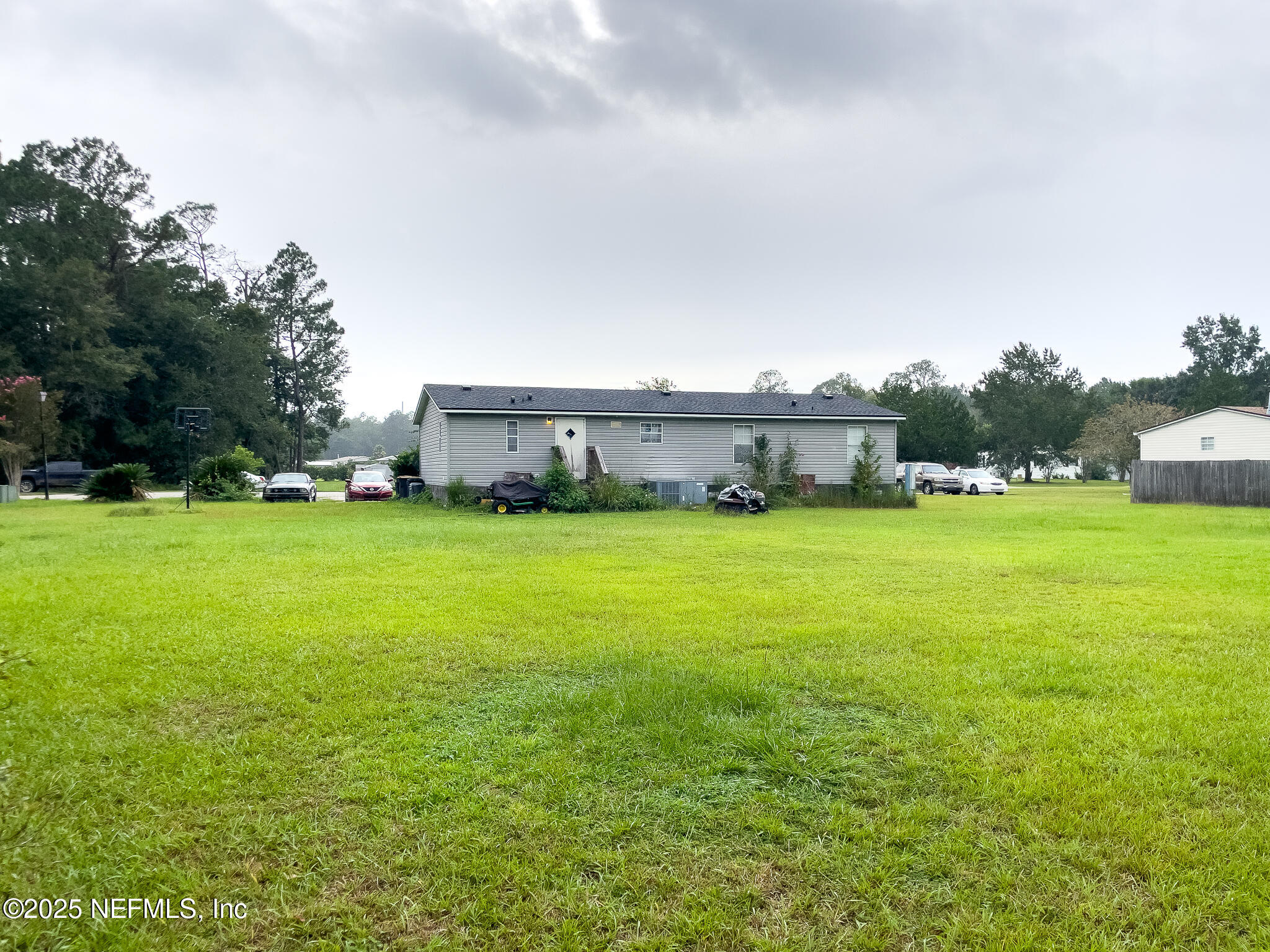 10259 Rabbit Ridge Road Jacksonville, FL 32219 - Photo 14 of 16 a view of yard with swimming pool and trees