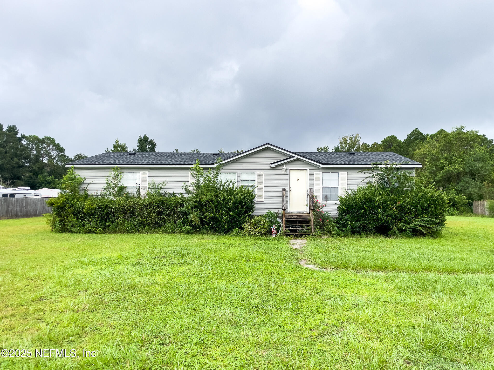10259 Rabbit Ridge Road Jacksonville, FL 32219 - Photo 10 of 16 a view of a house with a big yard and a fountain