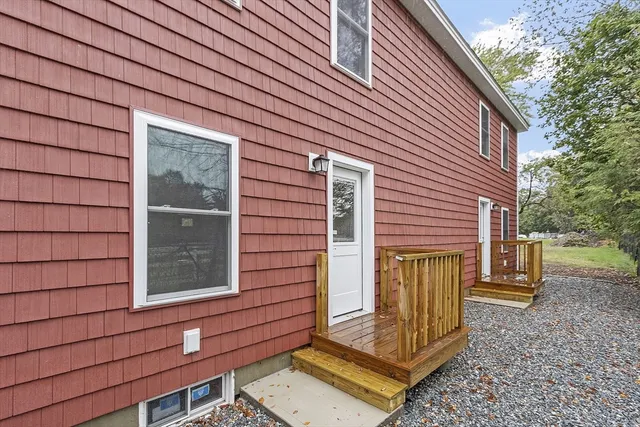 a view of a house with a door and wooden floor