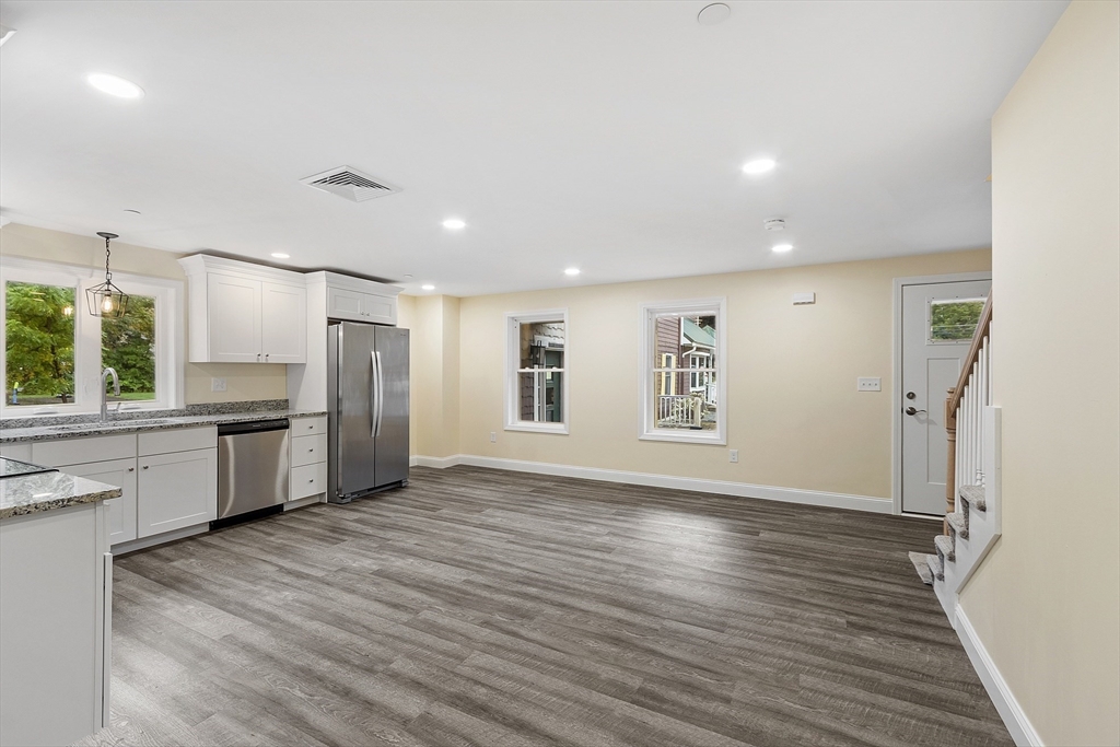 20 Townsend Street, Unit 2 Pepperell, MA 01463 - Photo 5 of 23 a view of kitchen with stainless steel appliances wooden floor and cabinets