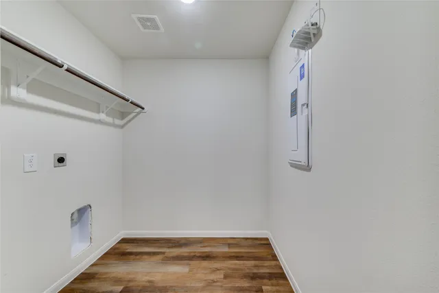 a view of an empty room with windows